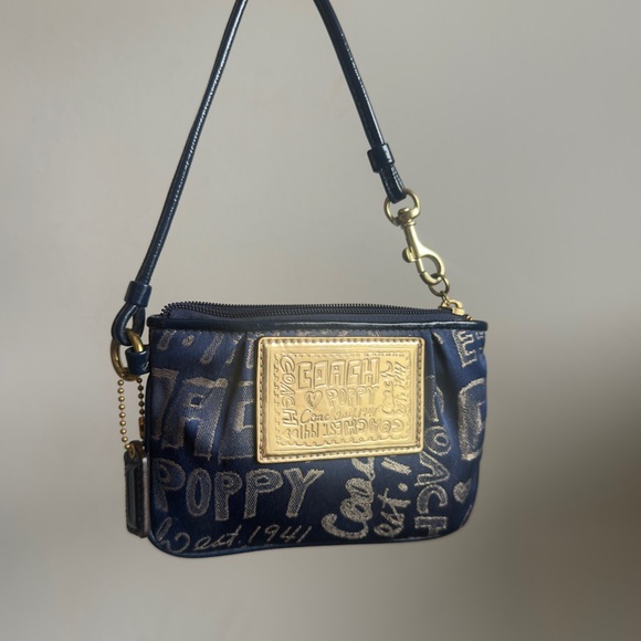 Coach Handbags - Authentic Coach x Poppy mini wristlet/clutch